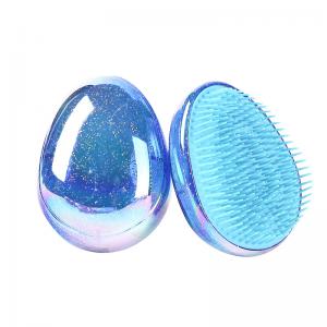 Egg-shaped detangler hair brushes